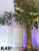 Groer, knstlicher Olivenbaum (knstlich) als Dekoration in einem Treppenaufgang